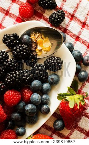 Macro View Of Blackberries, Blueberries, Raspberries And Muesli