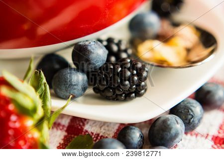 Macro View Of Blackberries, Blueberries, Strawberries And Muesli