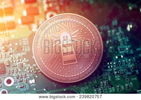 Shiny Copper Trackr Cryptocurrency Coin On Blurry Motherboard Background Token