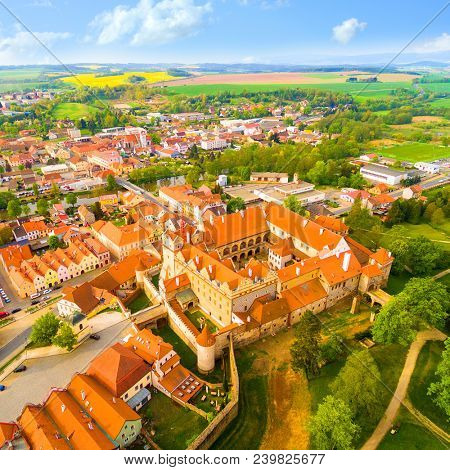 Medieval town Horsovsky Tyn founded in the  1184. The downtown with fascinating monumental renaissance castle. Czech Republic. Aerial view of a landmark in Czech Republic.