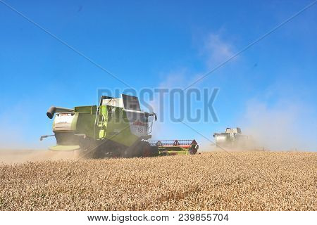 Ternopil - July 20: A Few Combines Cutting A Swath Through The Middle Of A Wheat Field During Harves