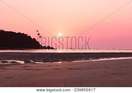 Tropical Beach In Ebb Time On Sunset. Seascape In Pastel Pink Colors, Mobor Beach, South Goa, India.