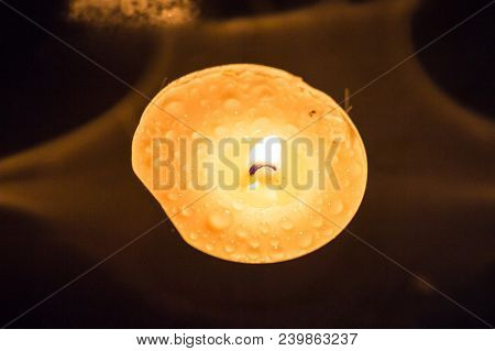 Candle At Night On Snow In The Winter