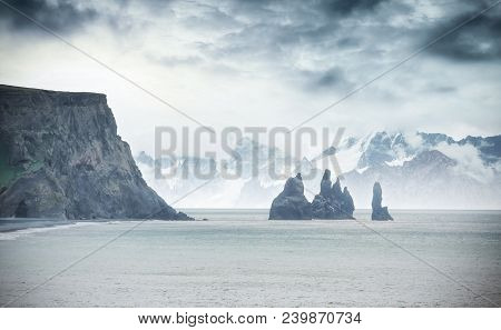 Famous Reynisdrangar Rock Formations At Black Reynisfjara Beach. Coast Of The Atlantic Ocean Near Vi