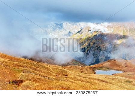 Majestic Mountain Landscape. Koruldi Lakes And A Tourist Admiring The View. Active Life Concept.