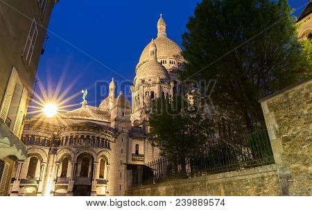 The Basilica Sacre Coeur Is A Roman Catholic Church Located At The Summet Of The Butte Montmartre , 