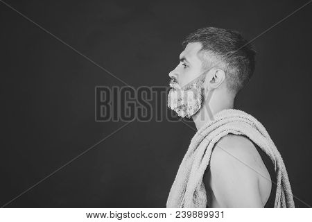 Man With Shaving Gel On Beard And Mustache. Serious Hipster In Barbershop, New Technology. Barber An