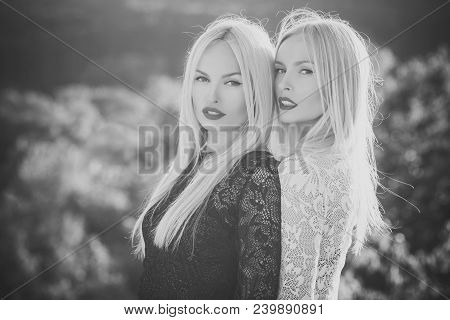 Two Women With Red Lips And Long Blond Hair. Dualism And Dualistic Nature. Contrasts And Opposites C