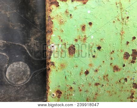 Broken Green Wall Behind The Black Rubber
