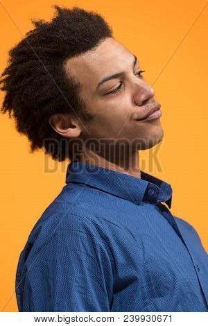 Argue, Arguing Concept. Beautiful Male Half-length Portrait Isolated On Orange Studio Backgroud. You