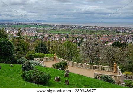 Prestatyn, Uk; April 2018; Chainsaw Sculptures Of A Woman And Man Look Out Across Prestatyn Towards 