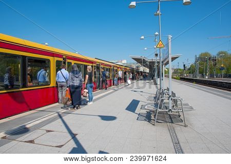 Berlin Germany - April 20. 2018: People Waiting To Board S-bahn Train At Berlin Charlottenburg Train