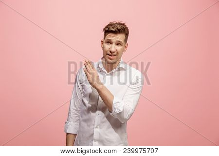 Secret, Gossip Concept. Young Man Whispering A Secret Behind His Hand. Businessman Isolated On Trend