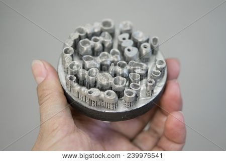 Object Printed On Metal 3d Printer. Dental Crowns Created In A Laser Sintering Machine Close-up. Dml