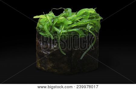 Оne Sushi With Algae Chuka On A Black Background
