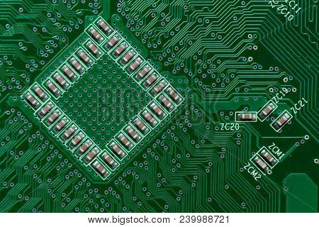 Ceramic Capacitors On Green Digital Electronic Circuit Board Texture Pattern Background