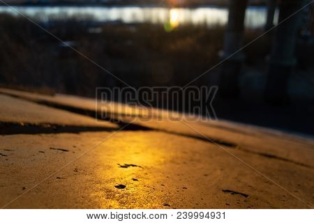 Concrete Golden Bridge Slabs By The River At Sunset