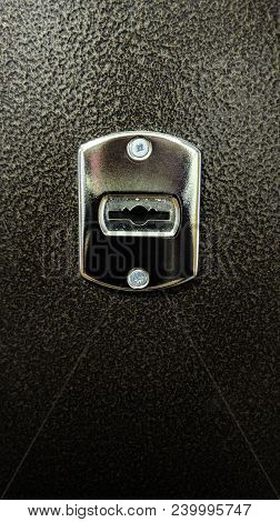 Metal Shiny Keyhole On Iron Embossed Door
