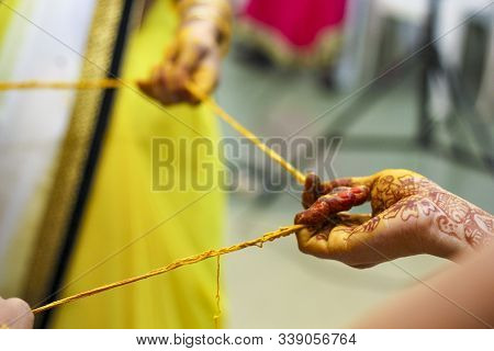 Indian Traditional Wedding: Haldi Ceremony Putting Turmeric In Hand
