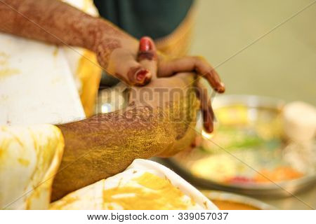 Indian Traditional Wedding: Haldi Ceremony Putting Turmeric In Hand