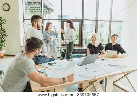 Ordinary But Very Bright And Spacious Office. A Team Of Beautiful Young Professionals Are Working On