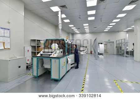 Moscow, Russia - Dec. 5.2019. Worker At The Machine In Mikron - Largest Plant For Production Of Chip