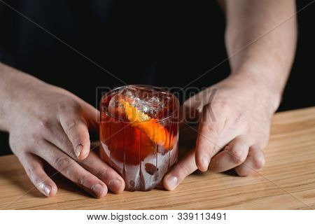 Boulevardie Cocktail On A Bar Desk. Black Background
