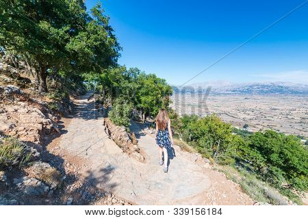 Girl Tourist Go From The Dikteo Andro Cave Also Known As Birth Place Of Zeus In Crete, Greece