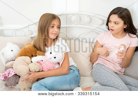 Kids Play Toys In Bed. Little Girls Spend Time Together. Teach Sister Sharing Toys. Greedy Sisters. 