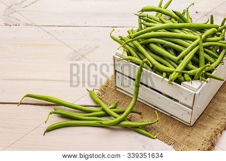Phaseolus Vulgaris, Green Common Bean Or Kidney Bean In Wooden Box