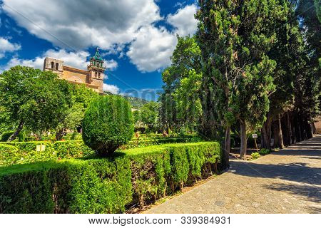 Valdemossa Monastery Historic Building And Vivid Green Garden