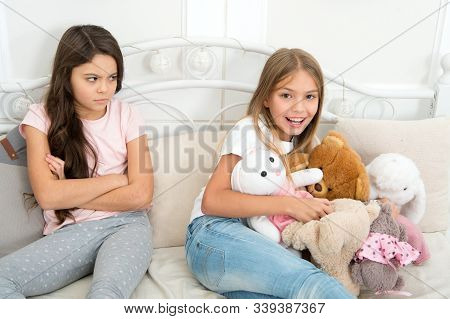 Kids Play Toys In Bed. Little Girls Spend Time Together. Friendship Sisterhood Personal Relations. T