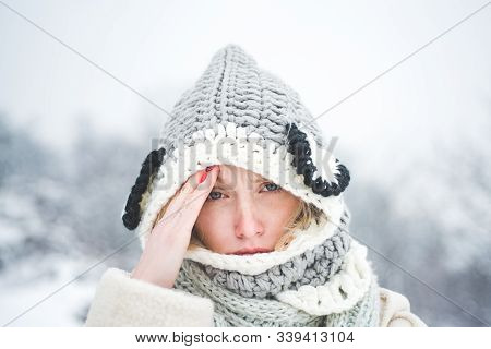 Allergy Winter Season. Portrait Of Beautiful Young Blonde Touching Her Temples Feeling Stress, On Sn