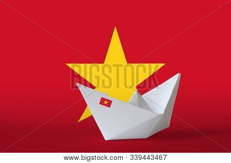Vietnam Flag Depicted On Paper Origami Ship Closeup. Handmade Arts Concept