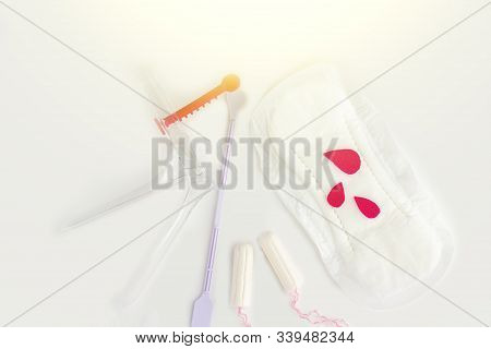 Protective Menstrual Pads, Cotton Tampons, Gynecologic Speculum
On White Background.  Medical Equipm