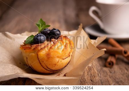 Cooked Mint Cupcake On A Wooden Table With Cinnamon