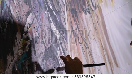 Artist Designer Draws An Eagle On The Wall. Craftsman Decorator Paints A Picture With Acrylic Oil Co