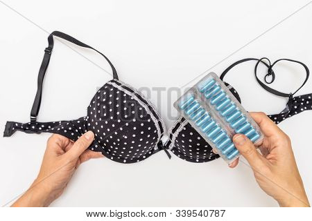 Hands Holding Bra And Blister Of Pills For Mastopathy Treatment Therapy, Mammalogy Concept.