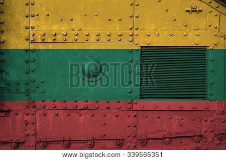 Lithuania Flag Depicted On Side Part Of Military Armored Tank Closeup. Army Forces Conceptual Backgr