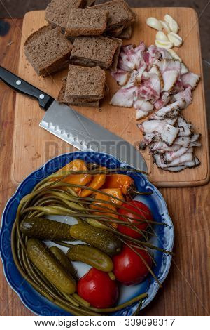 Bacon, Bread And Cucumber Over Wooden Background. Russian And Ukrainian Traditional Appetizer, Black