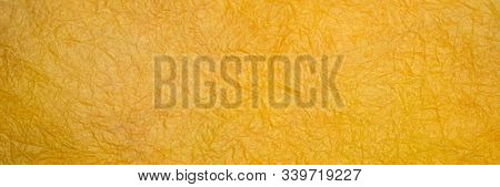 background of yellow marbled momi paper, panoramic banner