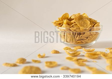 Cornflakes In A Plate On A Light Background. Selective Focus