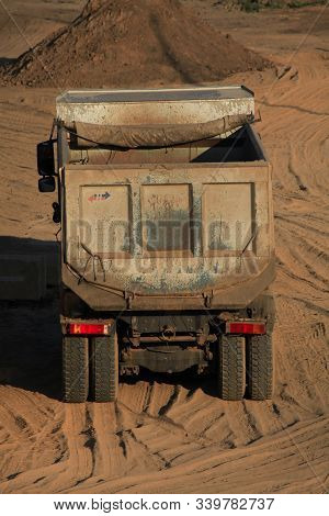 Multi-ton Dump Truck (lorry) Or Tip Truck At A Construction Site. Construction Equipment And Machine