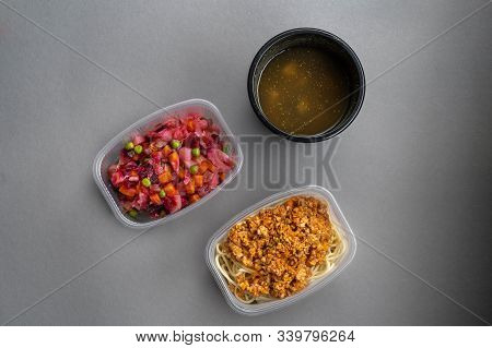 Pasta With Minced Meat And Onion In Navy-style And A Jar Of Vinaigrette On A Gray Background. Food F