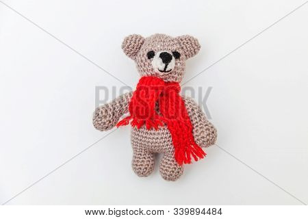 Simply Minimal Design With Toy Bear In Red Scarf Isolated On White Background. Children Care Materin