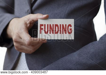 Business Woman Holds A Banner With The Inscription Finansial Tips. Business Concept.
