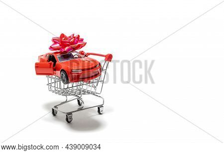 Red Vintage Car With Red Bow In Troley Isolated On White Background.