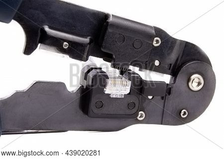 Compression Of The Internet Connector Using A Crimper For Crimping Rj 45. Internet Network Connector