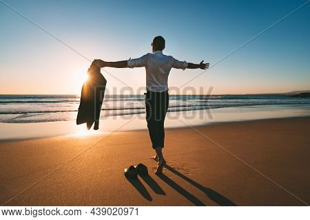 Life Is Good. Man With Open Arms Enjoying Life And Freedom On The Beach With Sunset