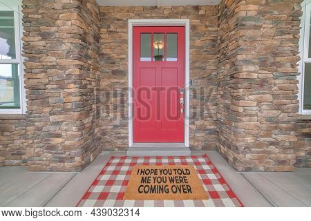 Red Front Door With Glass Panels And Funny Doormat Design